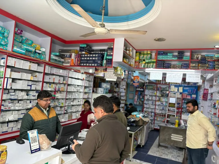 Serving customers at the counter — Gautam Chemist, Panchkula